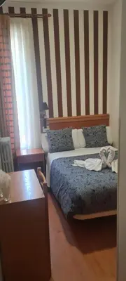 Cama o camas de una habitación en Hostal Salomé