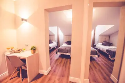 Cama o camas de una habitación en Hostal Lisboa