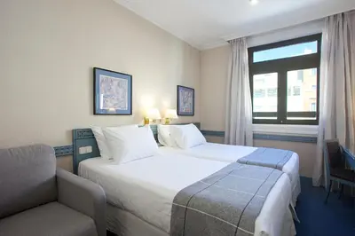 Cama o camas de una habitación en Espahotel Gran Vía