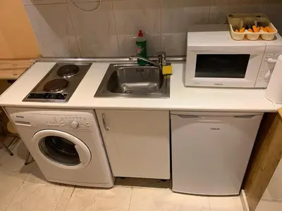 Una cocina o zona de cocina en Apartamentos Torr en Madrid - Chamartín