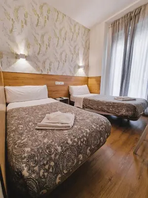 Cama o camas de una habitación en Hostal Comercial