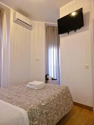 Cama o camas de una habitación en Hostal Comercial