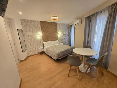 Cama o camas de una habitación en Hostal Comercial