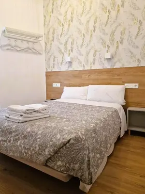 Cama o camas de una habitación en Hostal Comercial