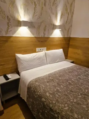 Cama o camas de una habitación en Hostal Comercial