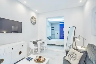 Una televisión o centro de entretenimiento en LEEWAYS LOFT I in HORTALEZA