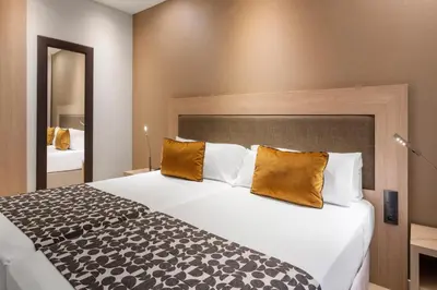 Cama o camas de una habitación en Catalonia Plaza Mayor