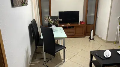 Una televisión o centro de entretenimiento en Apartamento Atocha-Delicias! 4PAX