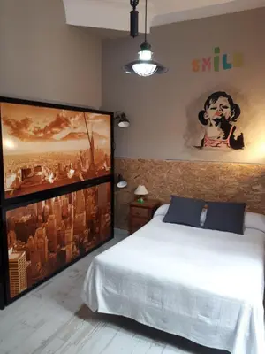 Cama o camas de una habitación en Hostal Hispalense