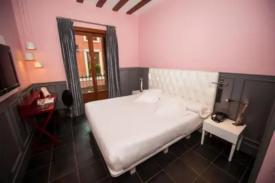 Cama o camas de una habitación en Posada del León de Oro Boutique Hotel