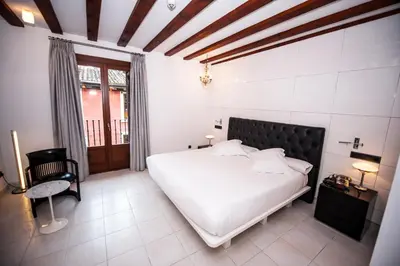 Cama o camas de una habitación en Posada del León de Oro Boutique Hotel
