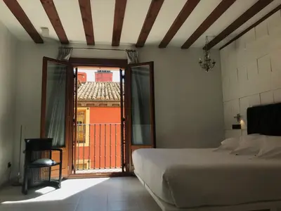 Cama o camas de una habitación en Posada del León de Oro Boutique Hotel