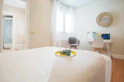 Cama o camas de una habitación en Heima Puerta del Sol - Plaza Santa Ana