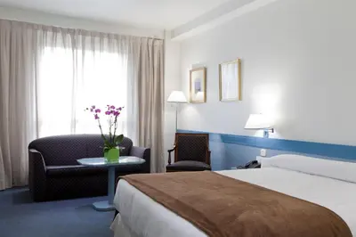 Cama o camas de una habitación en Espahotel Plaza de España