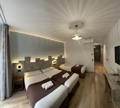 Cama o camas de una habitación en Hostal Anton Martin