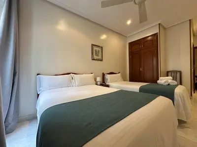 Cama o camas de una habitación en Hostal Villamañez