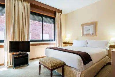 Cama o camas de una habitación en Espahotel Plaza Basílica