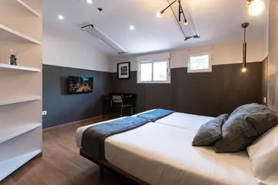 Cama o camas de una habitación en Suites You Zinc