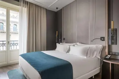 Cama o camas de una habitación en NH Collection Madrid Gran Vía