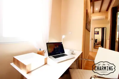 Una televisión o centro de entretenimiento en Plaza Mayor - Exclusivo Apartamento Dúplex