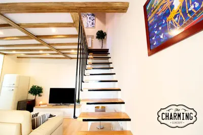 Una televisión o centro de entretenimiento en Plaza Mayor - Exclusivo Apartamento Dúplex