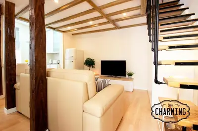 Una televisión o centro de entretenimiento en Plaza Mayor - Exclusivo Apartamento Dúplex