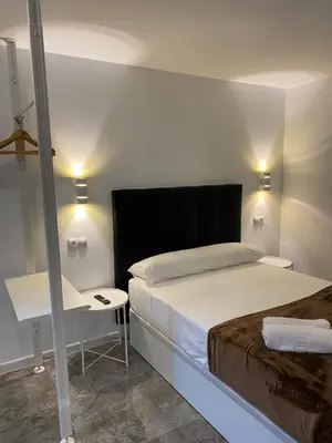 Cama o camas de una habitación en Hostal Alaska