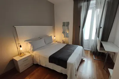Cama o camas de una habitación en Hostal Cervantes