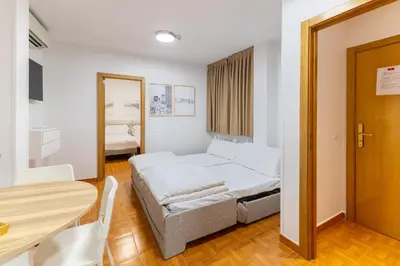 Cama o camas de una habitación en Apartamentos Madrid