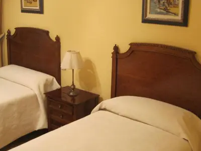 Cama o camas de una habitación en Hostal Gonzalo