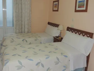 Cama o camas de una habitación en Hostal Gonzalo