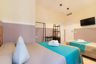Cama o camas de una habitación en Hostal Evoke Madrid