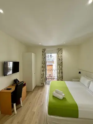 Cama o camas de una habitación en Apartamentos Apolo