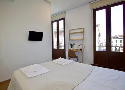 Cama o camas de una habitación en The Bridge Huertas - Hostal