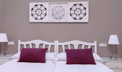 Cama o camas de una habitación en Hostal Bruña Paseo del Prado