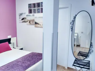 Cama o camas de una habitación en Hostal Bruña Paseo del Prado