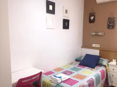 Cama o camas de una habitación en Alojamiento Jaén