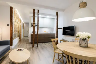 Una televisión o centro de entretenimiento en Madrid Center, Apartamento de 2 dormitorios