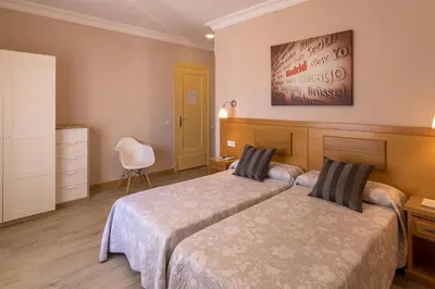 Cama o camas de una habitación en Hostal Santillan