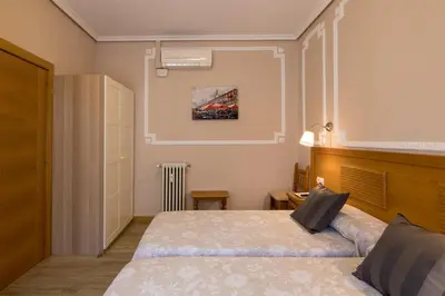 Cama o camas de una habitación en Hostal Santillan