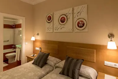 Cama o camas de una habitación en Hostal Santillan