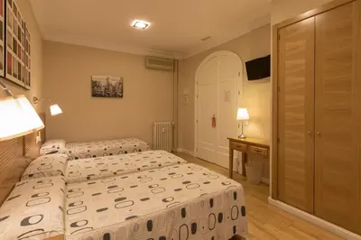 Cama o camas de una habitación en Hostal Santillan