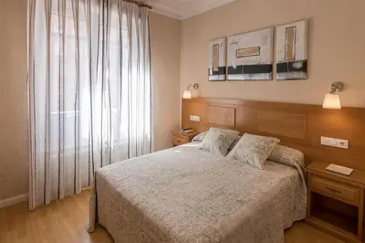 Cama o camas de una habitación en Hostal Santillan