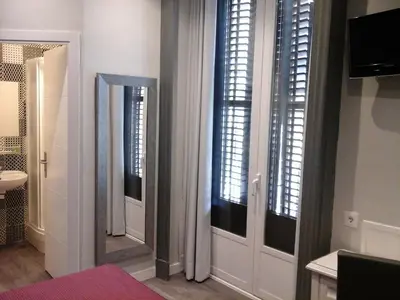 Cama o camas de una habitación en Hostal Don Alfonso