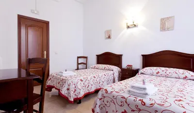 Cama o camas de una habitación en Hostal Condestable