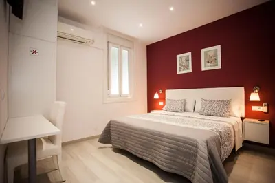 Cama o camas de una habitación en Pensión Corbero