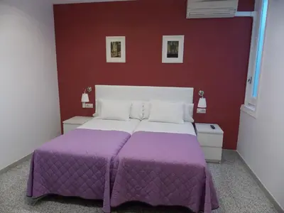 Cama o camas de una habitación en Pensión Corbero