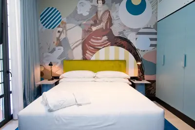 Cama o camas de una habitación en AmazINN Collection Madrid Amor de Dios