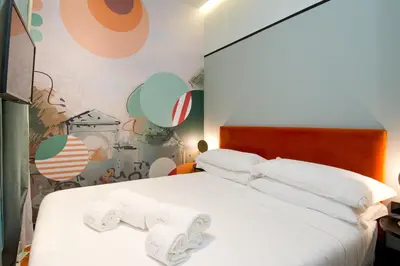 Cama o camas de una habitación en AmazINN Collection Madrid Amor de Dios