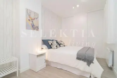 Cama o camas de una habitación en Castellana Suites